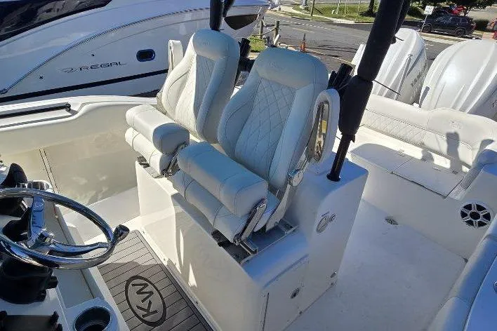  Yacht Photos Pics 2026 Key West 263 FS boat interior with luxurious seating and steering wheel.