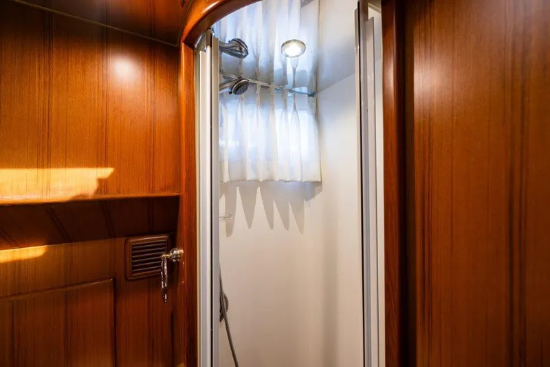  Yacht Photos Pics Wood-paneled shower area in 2000 Symbol 42 Classic Trawler yacht.