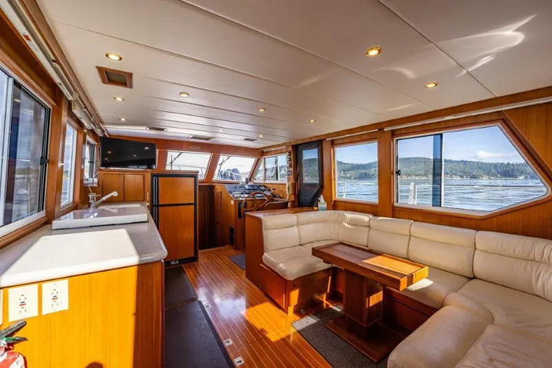  Yacht Photos Pics Interior of 2000 Symbol 42 Classic Trawler with wood finish and panoramic windows.