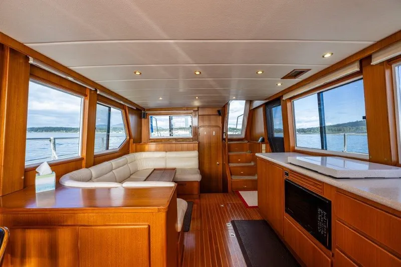  Yacht Photos Pics Interior of 2000 Symbol 42 Classic Trawler with wood finish and panoramic windows.