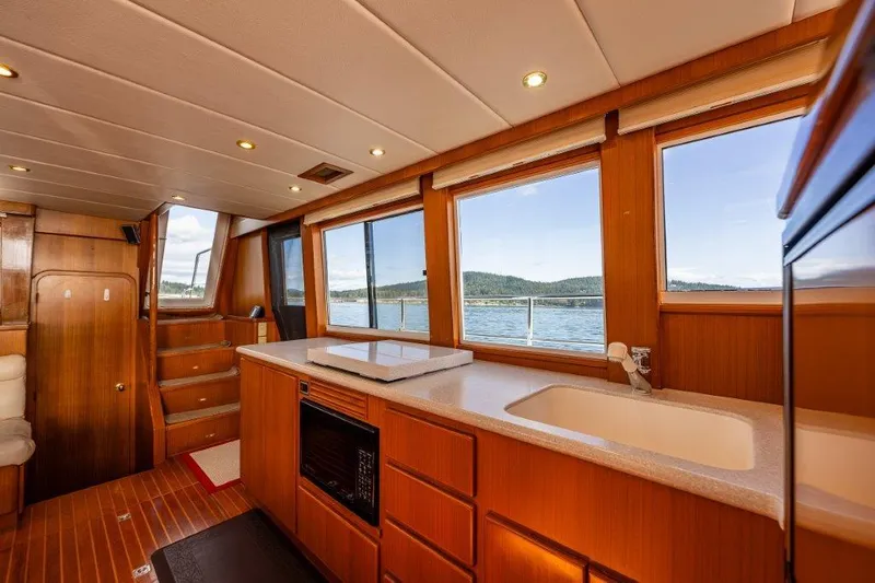  Yacht Photos Pics Interior of 2000 Symbol 42 Classic Trawler with wood finish and scenic windows.