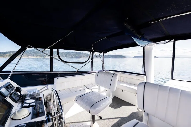  Yacht Photos Pics Interior of 2000 Symbol 42 Classic Trawler with white seating and ocean view.