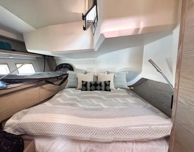  Yacht Photos Pics Luxurious bedroom interior of 2019 Hanse 588 yacht with modern design and cozy bedding.