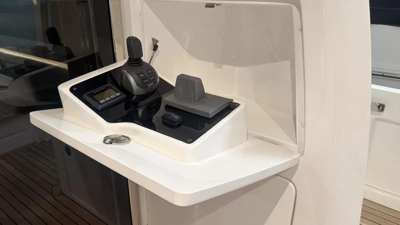 F55163 Yacht Photos Pics Control panel of 2023 Princess F55 yacht with joystick and throttle.