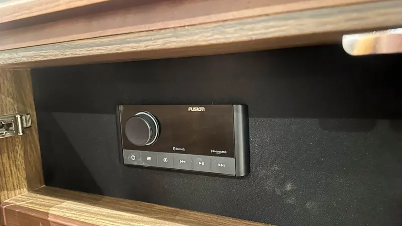 F55163 Yacht Photos Pics Audio control panel in a 2023 Princess F55 yacht interior.