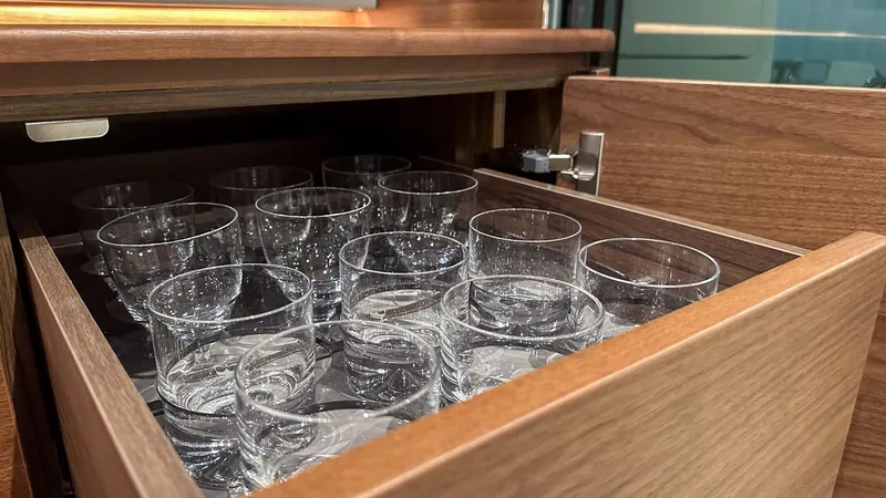 F55163 Yacht Photos Pics Drawer with neatly arranged glassware on a 2023 Princess F55 yacht.