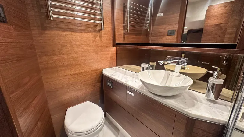 F55163 Yacht Photos Pics Luxurious bathroom in 2023 Princess F55 yacht with modern fixtures and wooden accents.