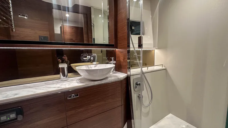 F55163 Yacht Photos Pics Luxurious bathroom in 2023 Princess F55 yacht with modern fixtures and elegant design.