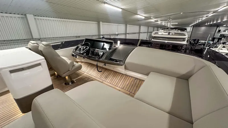 F55163 Yacht Photos Pics Luxurious 2023 Princess F55 yacht interior with modern seating and sleek dashboard.