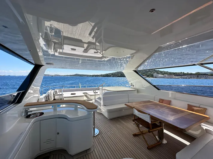 Lady Moh Yacht Photos Pics Luxurious interior of a 2002 Bugari 95 yacht with ocean view.