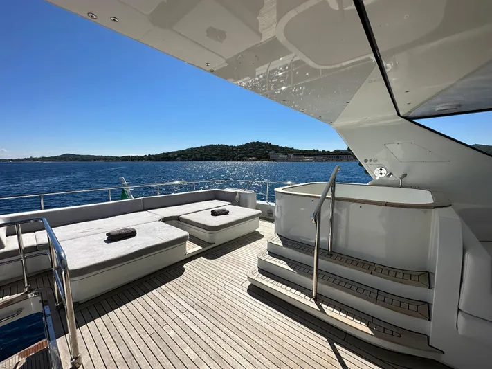 Lady Moh Yacht Photos Pics Luxury Bugari 95 yacht deck with sun loungers, ocean view, 2002 model.