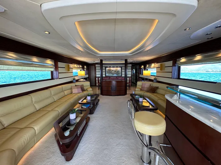 Lady Moh Yacht Photos Pics Luxurious interior of a 2002 Bugari 95 yacht with elegant seating and modern decor.