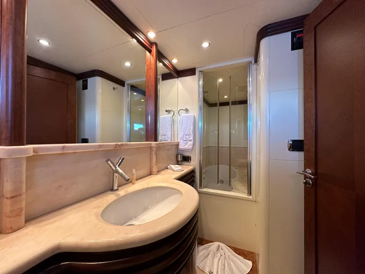 Lady Moh Yacht Photos Pics Luxurious bathroom in a 2002 Bugari 95 yacht with modern fixtures and elegant design.