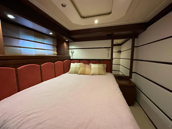 Lady Moh Yacht Photos Pics Luxurious bedroom in a 2002 Bugari 95 yacht with modern decor.