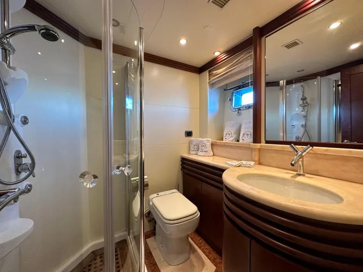 Lady Moh Yacht Photos Pics Luxurious bathroom in a 2002 Bugari 95 yacht with modern fixtures and elegant design.