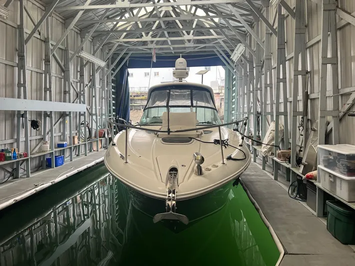  Yacht Photos Pics 2013 Sea Ray 330 Sundancer docked in a covered marina.