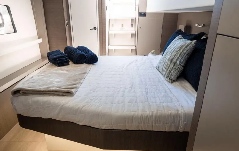  Yacht Photos Pics Luxurious bedroom interior on 2021 Bali 4.8 yacht with neatly arranged linens and pillows.