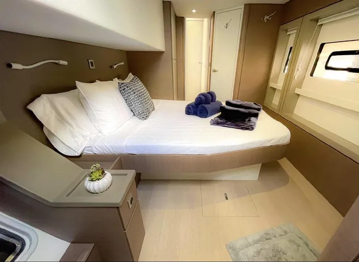  Yacht Photos Pics Luxurious bedroom interior of 2021 Bali 4.8 yacht with modern decor and cozy bedding.