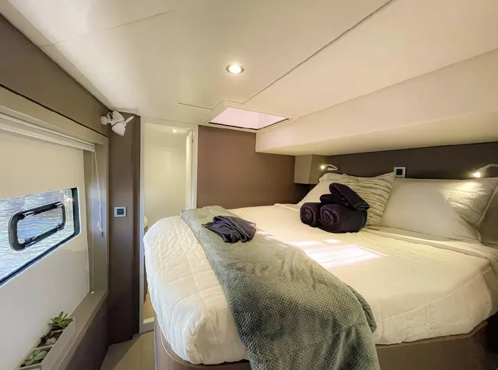  Yacht Photos Pics Luxurious bedroom interior of 2021 Bali 4.8 yacht with cozy bedding and modern design.