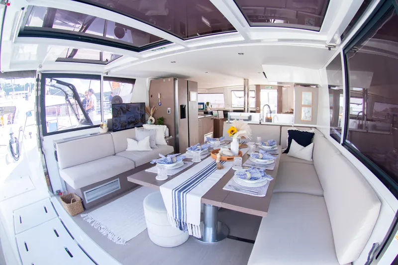  Yacht Photos Pics Luxurious interior of 2021 Bali 4.8 catamaran with elegant dining setup.
