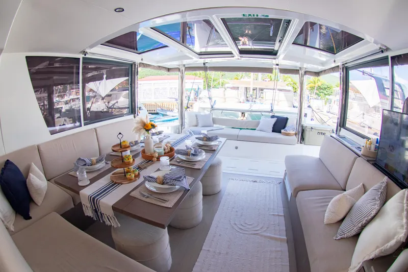  Yacht Photos Pics Luxurious interior of 2021 Bali 4.8 catamaran with elegant dining setup.
