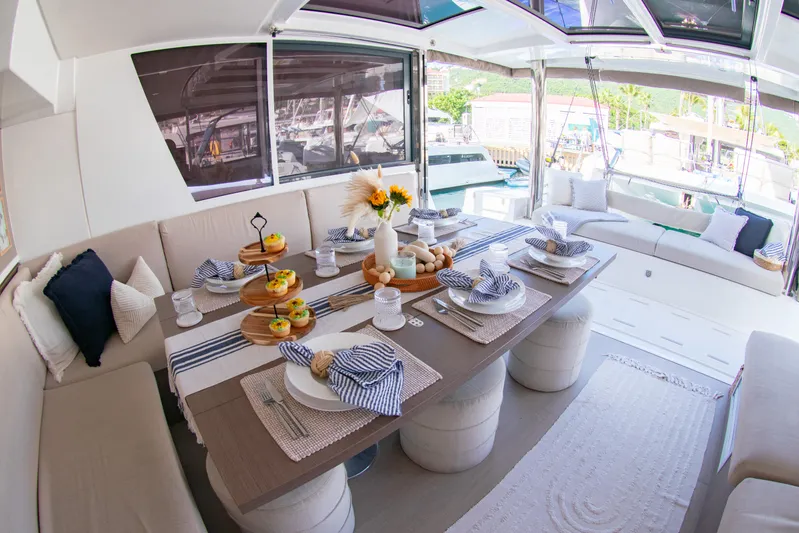  Yacht Photos Pics Luxurious Bali 4.8 yacht interior dining area, elegantly set table, 2021 model.
