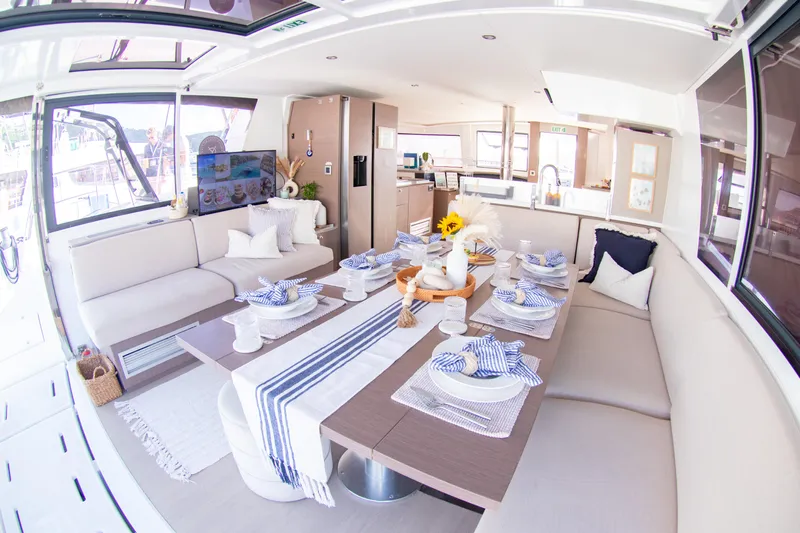  Yacht Photos Pics Luxurious interior of 2021 Bali 4.8 catamaran with elegant dining setup.