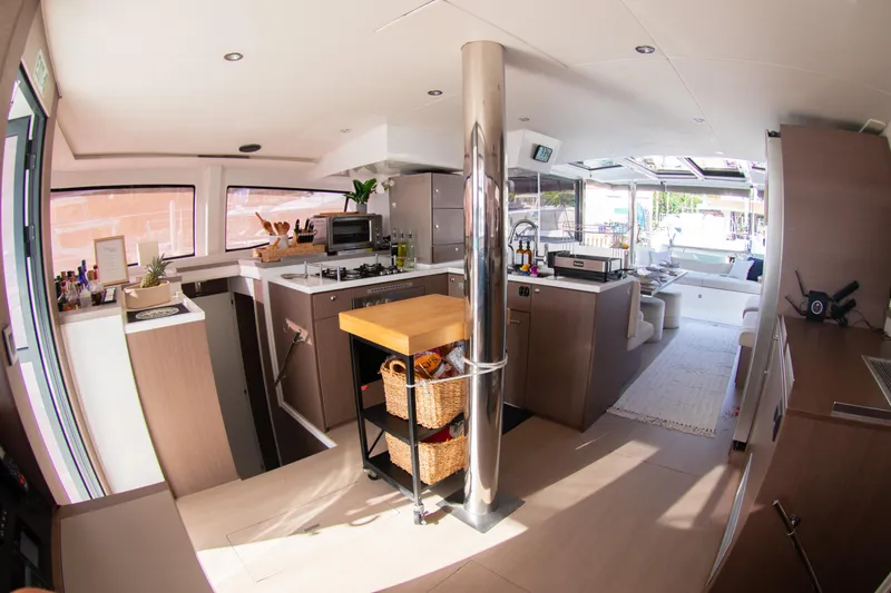  Yacht Photos Pics Modern interior of 2021 Bali 4.8 catamaran with spacious kitchen and lounge area.