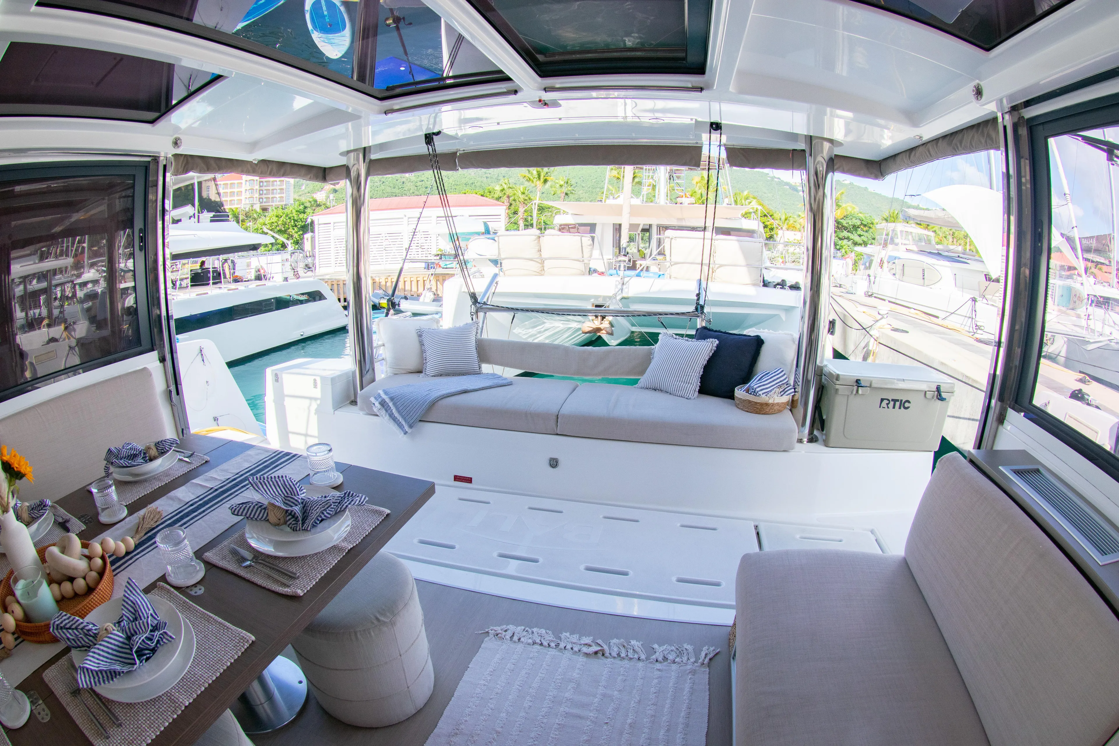  Yacht Photos Pics Luxurious interior of 2021 Bali 4.8 catamaran with elegant dining and lounging areas.