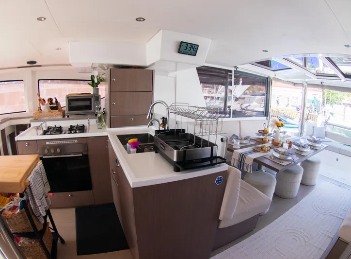  Yacht Photos Pics Modern kitchen and dining area inside 2021 Bali 4.8 catamaran yacht.