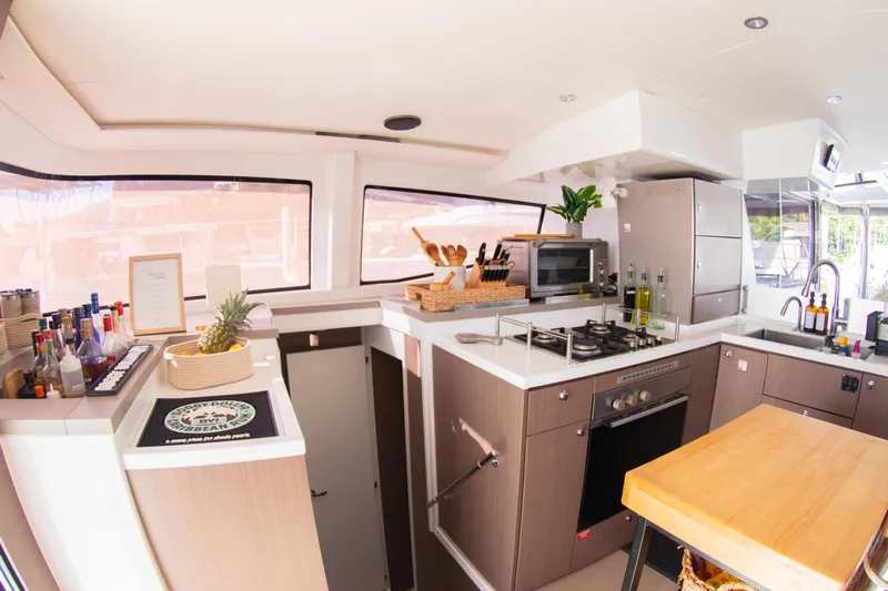  Yacht Photos Pics Modern kitchen interior on a 2021 Bali 4.8 yacht, featuring sleek appliances and ample counter space.