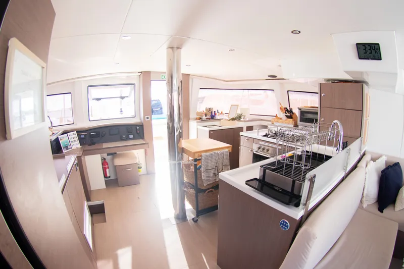  Yacht Photos Pics Spacious interior of 2021 Bali 4.8 catamaran with modern kitchen and seating area.