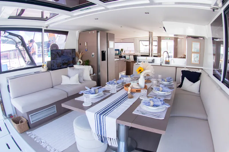  Yacht Photos Pics Luxurious 2021 Bali 4.8 yacht interior with elegant dining setup and modern decor.