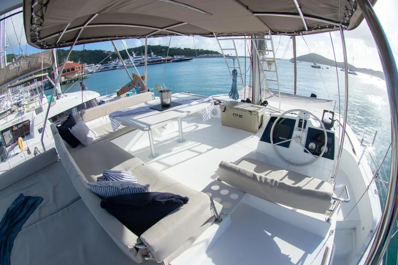  Yacht Photos Pics Luxurious 2021 Bali 4.8 yacht deck with seating, table, and ocean view.