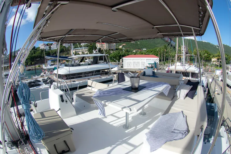  Yacht Photos Pics Luxurious 2021 Bali 4.8 catamaran with spacious deck and seating area in marina.