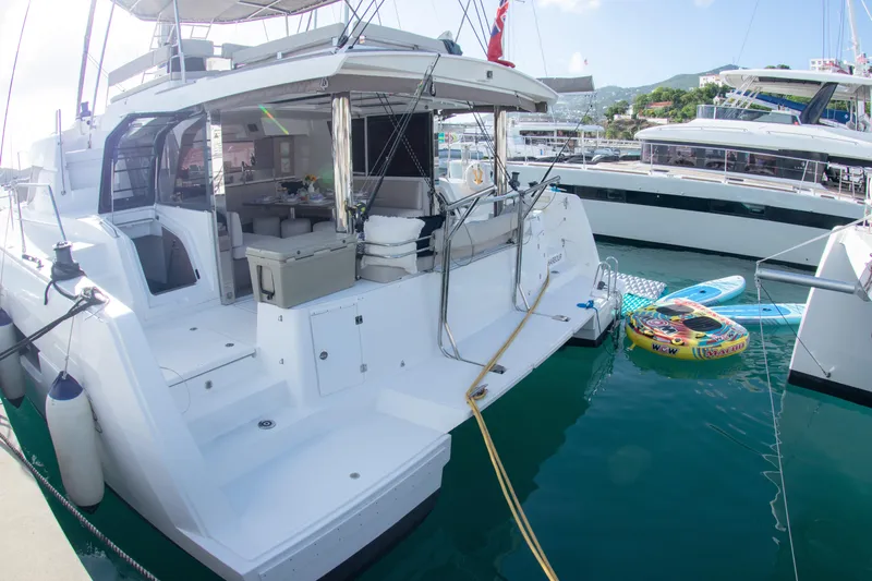  Yacht Photos Pics Bali 4.8 catamaran, 2021 model, docked with paddleboards and inflatables nearby.