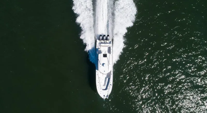  Yacht Photos Pics Aerial view of a 2022 Cape Horn 36 XS boat speeding on water.
