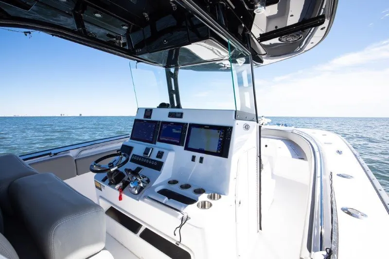  Yacht Photos Pics 2022 Cape Horn 36 XS boat dashboard with navigation screens on open water.