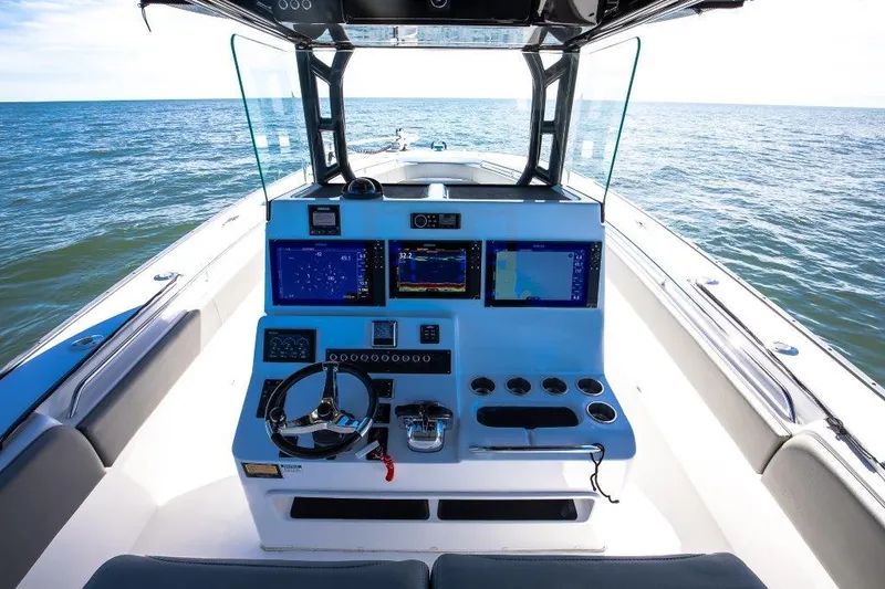  Yacht Photos Pics 2022 Cape Horn 36 XS boat dashboard with navigation screens and steering wheel.