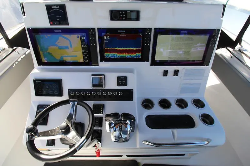  Yacht Photos Pics Control panel of a 2022 Cape Horn 36 XS boat with multiple Simrad displays.