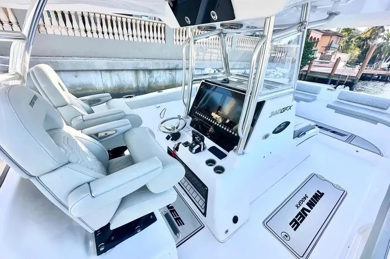  Yacht Photos Pics 2023 Twin Vee 340 GFX CC boat interior with modern helm and seating.