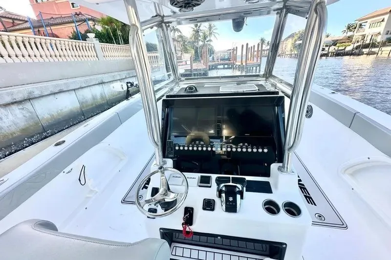  Yacht Photos Pics 2023 Twin Vee 340 GFX CC boat console with modern controls and waterfront view.
