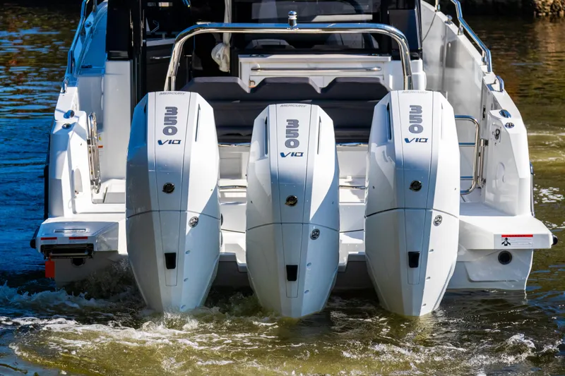  Yacht Photos Pics 2025 Wellcraft 355 boat with triple V10 engines on water.