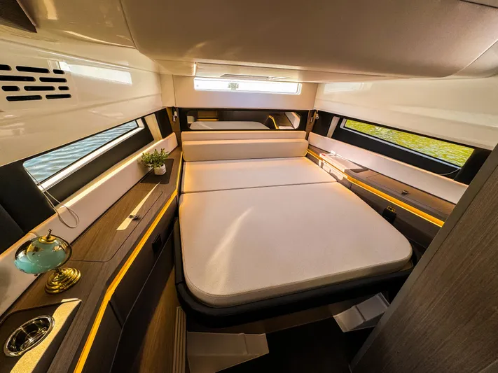  Yacht Photos Pics Luxurious interior cabin of 2025 Wellcraft 355 yacht with modern furnishings and ambient lighting.