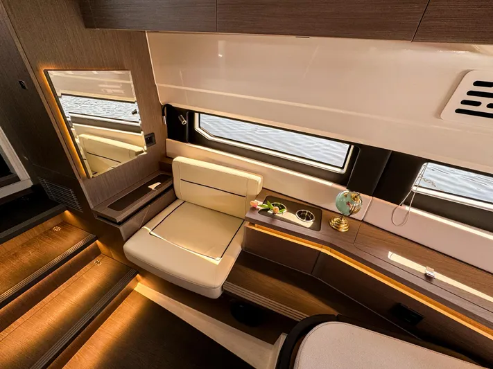  Yacht Photos Pics Luxurious interior of 2025 Wellcraft 355 yacht with elegant seating and ambient lighting.