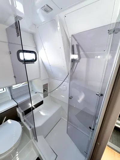  Yacht Photos Pics 2025 Wellcraft 355 yacht bathroom with modern fixtures and sleek design.