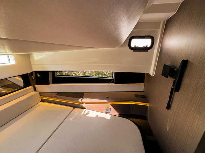  Yacht Photos Pics Interior cabin of 2025 Wellcraft 355 boat, featuring modern design and comfortable seating.