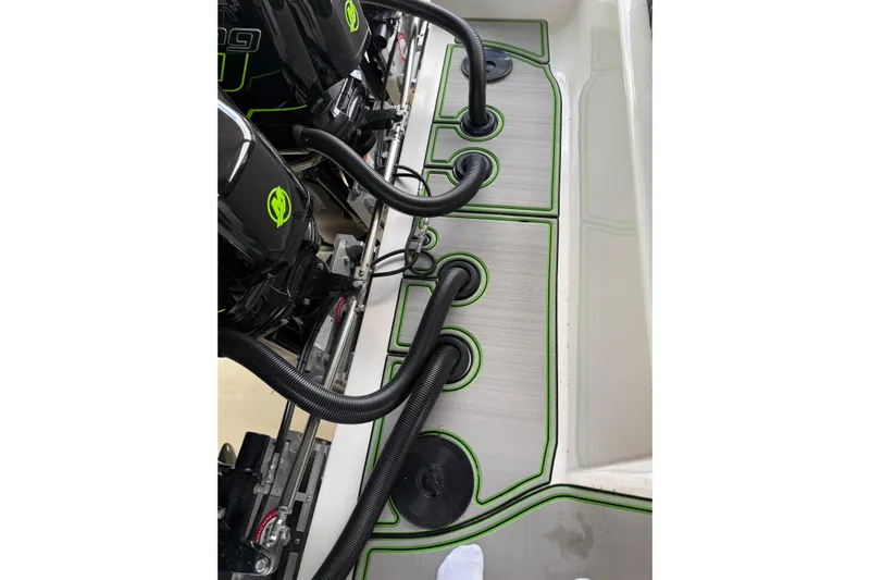  Yacht Photos Pics 2006 Fountain 38 CC Tournament Edition boat deck with engine cables and green accents.