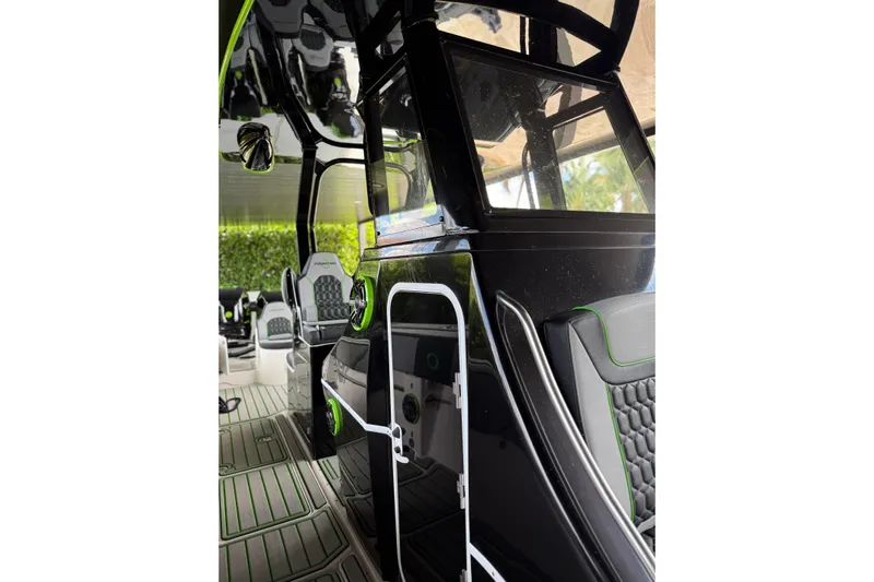  Yacht Photos Pics 2006 Fountain 38 CC Tournament Edition boat interior with sleek black and green design.