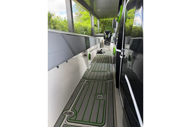  Yacht Photos Pics 2006 Fountain 38 CC Tournament Edition boat interior with green-accented flooring.